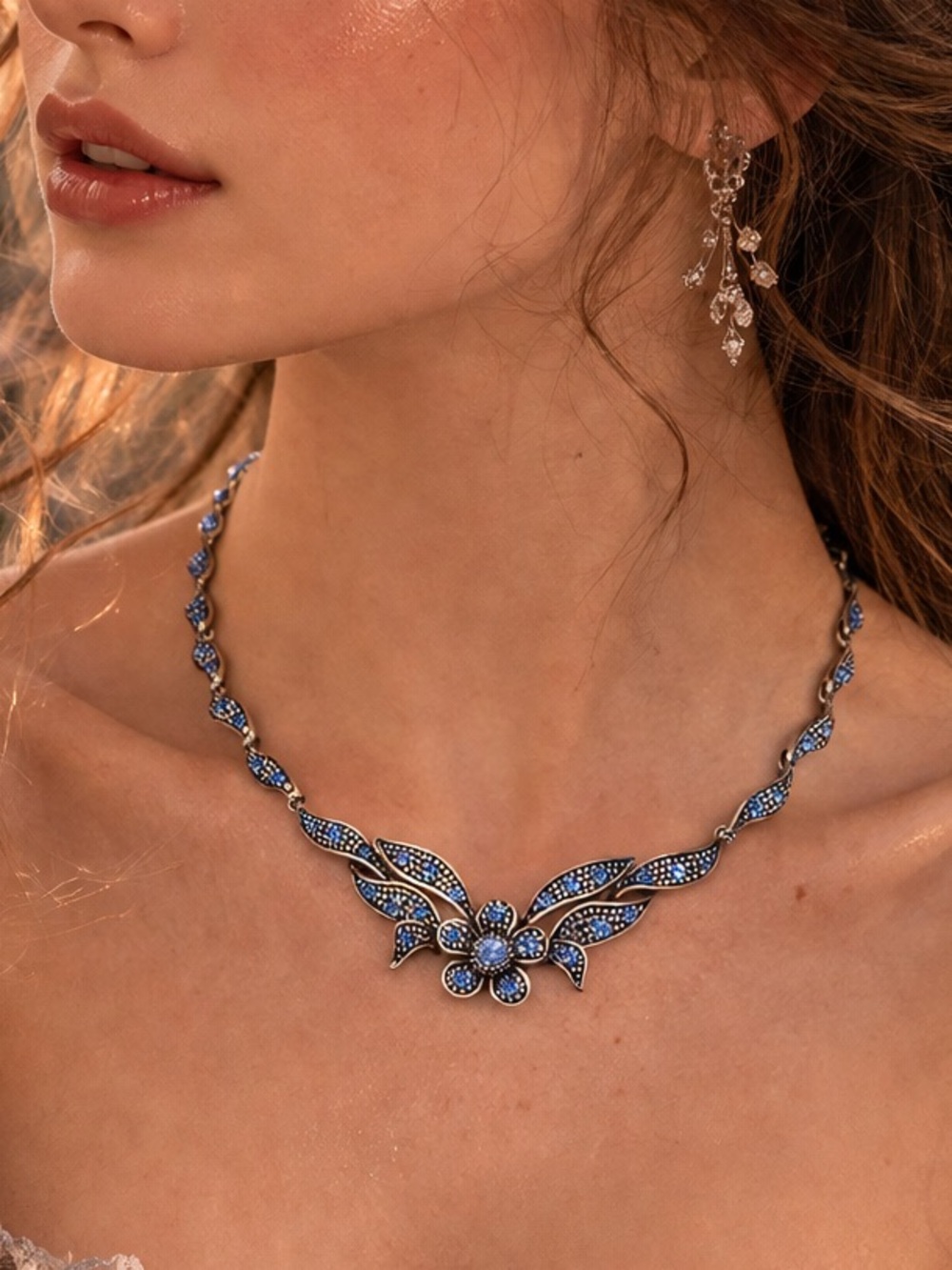Vintage-style silver tone statement necklace with crystal details